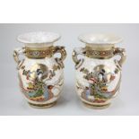 A pair of Japanese Satsuma ware two-handled vases decorated in raised relief with figures in flowing