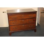 A George III mahogany chest of three drawers, with pull-out slide, on bracket feet, 102cm