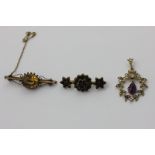 An amethyst and split pearl pendant, a citrine bar brooch and a garnet bar brooch