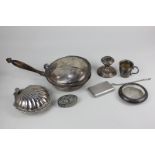 An American sterling silver dwarf candlestick on loaded circular base, a small christening mug,