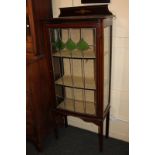 An Edwardian display cabinet with single lead light glazed door with green glass panels, 62cm