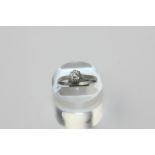A diamond single stone ring the old cut stone eight claw set in platinum