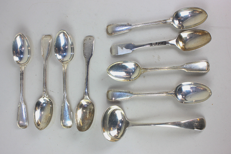 A collection of silver and white metal teaspoons, mustard spoons and coffee spoons, some with