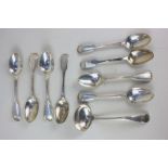 A collection of silver and white metal teaspoons, mustard spoons and coffee spoons, some with