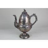 An unusual Victorian silver plated hot water jug in the form of an acorn, decorated in relief with