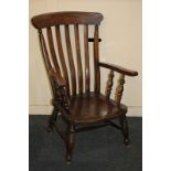 A slatted back farmhouse armchair with elm seat on turned legs (reduced in size)