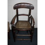 A 19th century Lincolnshire childs high chair, with wicker seat (a/f missing bar)