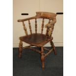A bow back elbow chair on turned supports, with elm seat