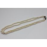 A two row pearl necklace, the graduated beads on a rose diamond set clasp