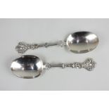 A pair of Victorian silver serving spoons, maker Charles Stuart Harris, London 1891, with figural