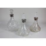 Two similar modern silver mounted cut glass decanters, flared form with associated stoppers, 29cm,