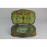 A Continental painted sewing box with upholstered pincushion lid enclosing fitted interior decorated