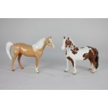 A Beswick model of a Pinto pony, skewbald gloss, 16.5cm, and a Palomino pony, gloss, 16.5cm