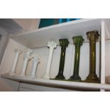 A collection of nine 19th century and later pottery column candlesticks, tallest 30cm