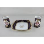 A pair of 19th century porcelain spill vases with hand painted floral design and shell and star gilt