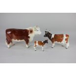 A Beswick model of a Hereford bull, brown and white gloss, 15cm, together with an Ayrshire cow