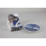 A Copenhagen miniature porcelain plate depicting a building on a coastline, 10.5cm, together with