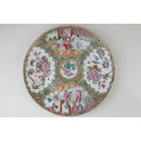 A Chinese Cantonese porcelain plate decorated with panels depicting figures, flowers and birds, 24.