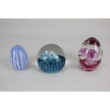 A Caithness paperweight, Quicksilver, a Murano glass paperweight, and another paperweight