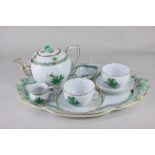 A Herend porcelain cabaret tea set in the green Chinese Bouquet pattern, with teapot, two cups and