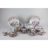A Chinese Cantonese pottery teapot, a Chinese tea bowl, a Japanese teapot, teacups, saucers and