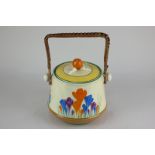 A Bizarre by Clarice Cliff crocus pottery biscuit barrel with wicker handle, 19cm