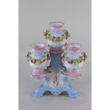 A 19th century French (possibly Charenton) porcelain centrepiece with four floral bocage decorated