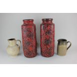 A large pair of 20th century West German pottery vases with impressed circular design on red and