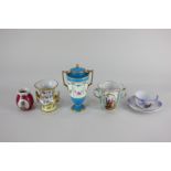 A Dresden porcelain chocolate cup, a French porcelain baluster spill vase, an urn and cover with