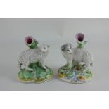 A pair of Staffordshire spill vases modelled as a ram and a sheep, 13.5cm, (a/f)