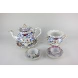 A 19th century Staffordshire porcelain teapot with matching sucre (missing lid) and teapot stand,