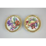 A pair of Paragon porcelain oval wall plaques with hand painted designs of flowers and fruit, with