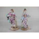 A pair of 19th century French, possibly Charenton, porcelain figures of a lady (a/f) and