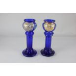 A pair of Victorian blue glass vases, each with floral decoration and gilt embellishments, 22cm