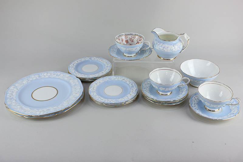 A Paragon porcelain fortune telling cup and saucer, together with a Paragon part tea service with