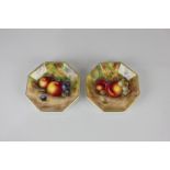 A pair of Royal Worcester porcelain octagonal pin dishes, hand painted with fruit, both signed P C