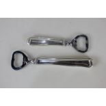 A graduated pair of Georg Jensen Danish silver handled bottle openers, with steel blades, etched