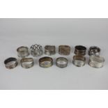 A collection of twelve silver napkin rings, various dates and makers, 6oz