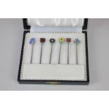 A set of six Danish silver cocktail sticks by Meka, each with enamel flower finial, marked Meka