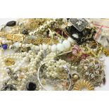 A collection of costume jewellery and a white painted jewel casket