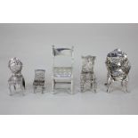 A collection of five Victorian and later silver miniature models of chairs, some with import