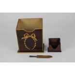 A Regency satinwood stationery holder with inlaid wreath design, together with a rosewood stamp