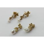 A pair of baroque pearl drop earrings in yellow gold, and a pair of pearl drop earrings in 9ct gold