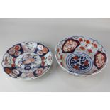 A Japanese Imari pattern porcelain dish (a/f - stapled), 23cm, together with an Imari bowl, 21.5cm