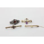 An opal bar brooch, two amethyst bar brooches, and a silver and garnet brooch