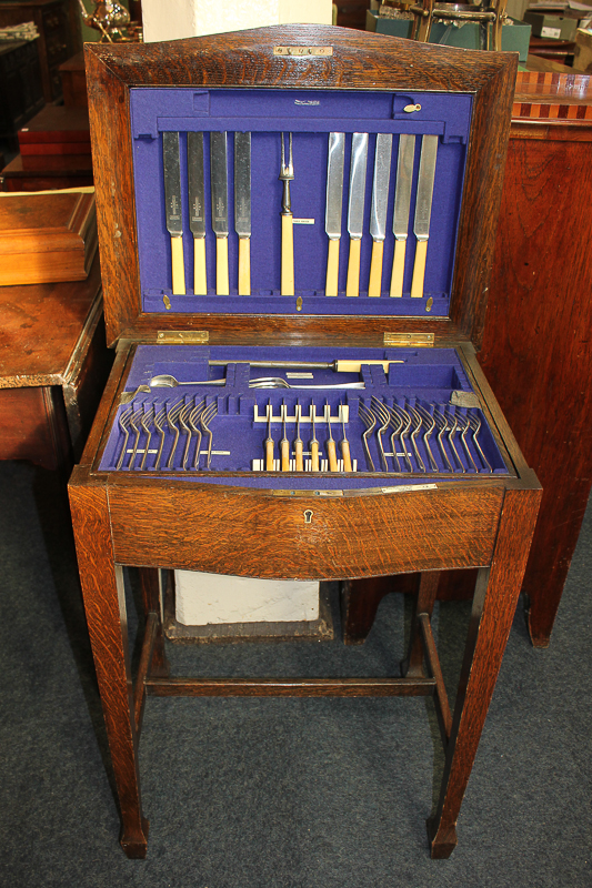 A Joseph Rodgers & Sons silver plated Hanoverian pattern part canteen in oak cabinet