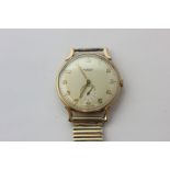 A 9ct gold wristwatch by Benson with engraved inscription to reverse, gilt metal bracelet strap (a/