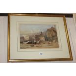 J E Buckley (19th century), figures amongst buildings, cliffs and church beyond, watercolour, signed
