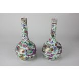 A pair of Chinese porcelain vases depicting dragons chasing a flaming pearl (a/f), 17.5cm high