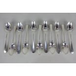 A set of eleven Edward VII silver Old English pattern teaspoons, terminals with engraved initial,